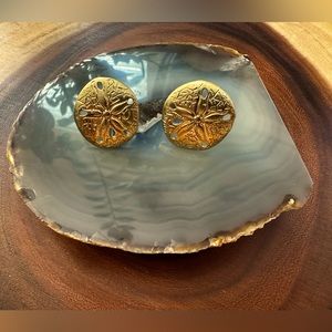Gold tone sand dollar clip on earrings